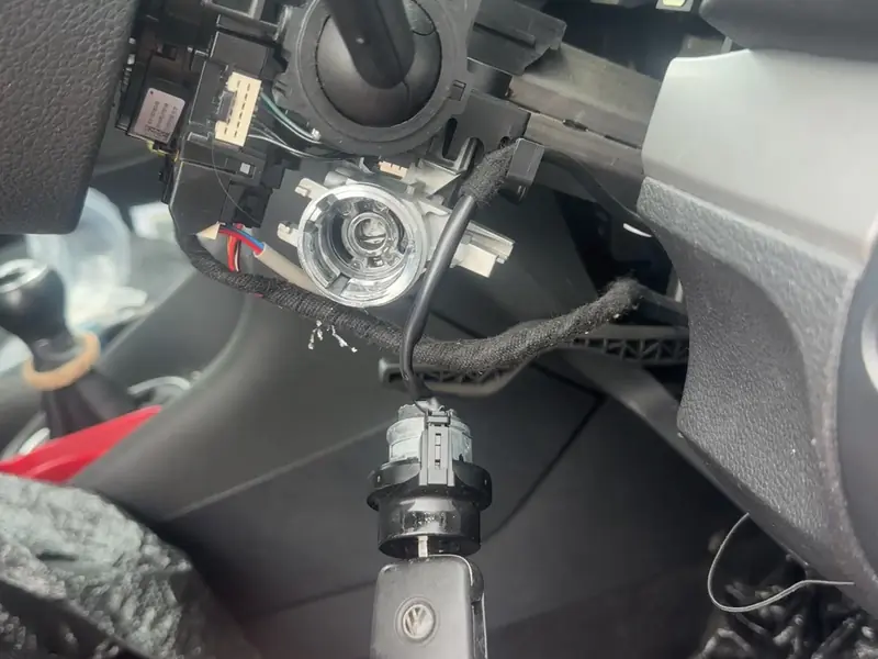Auto locksmith repairing a vehicle ignition lock and ignition barrel in Coventry.