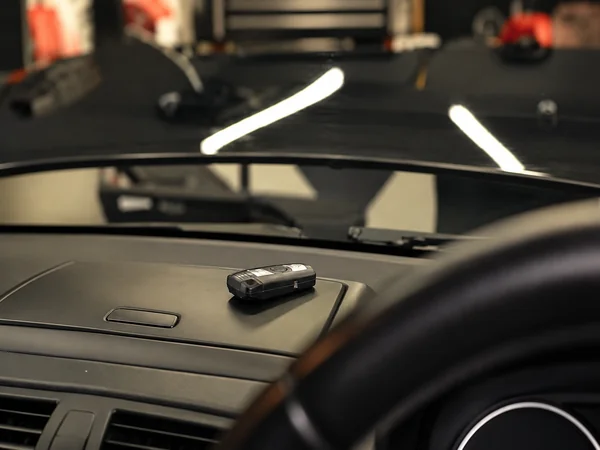 Car keys left inside a locked vehicle, ready for professional mobile auto locksmith assistance.